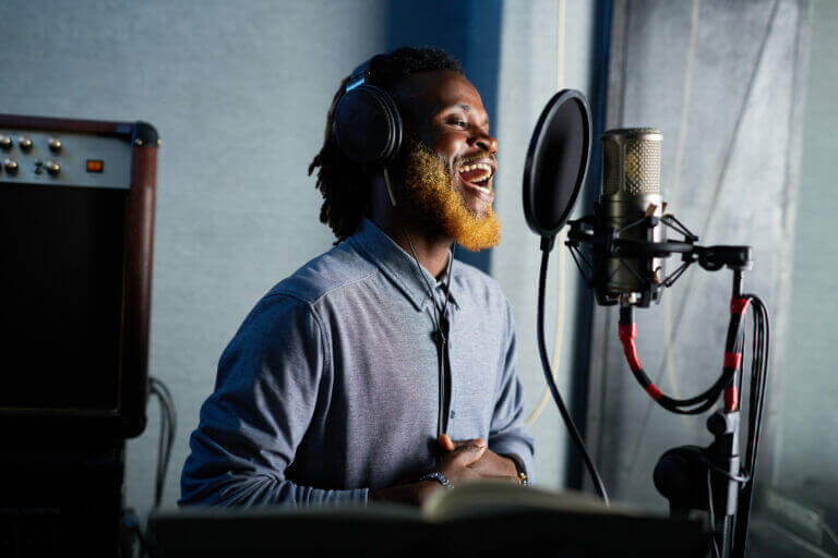 A voiceover artist recording his lines.